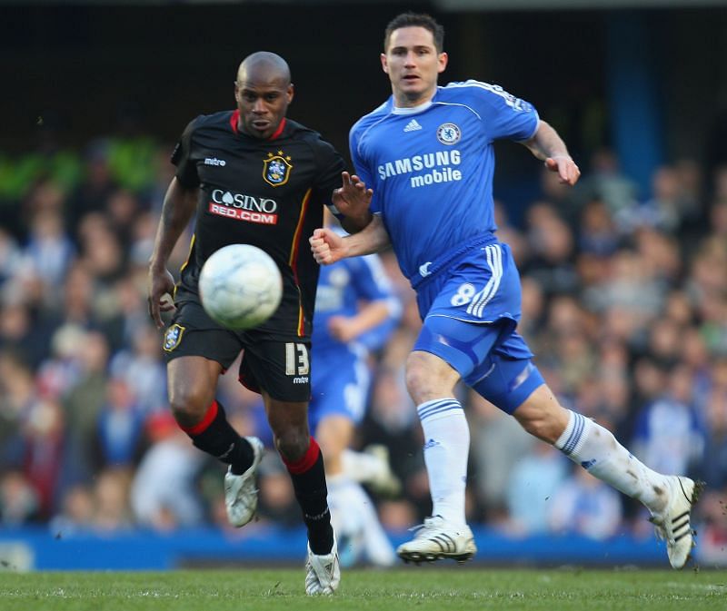 Ex-Chelsea defender Sinclair (L) competing with Frank Lampard
